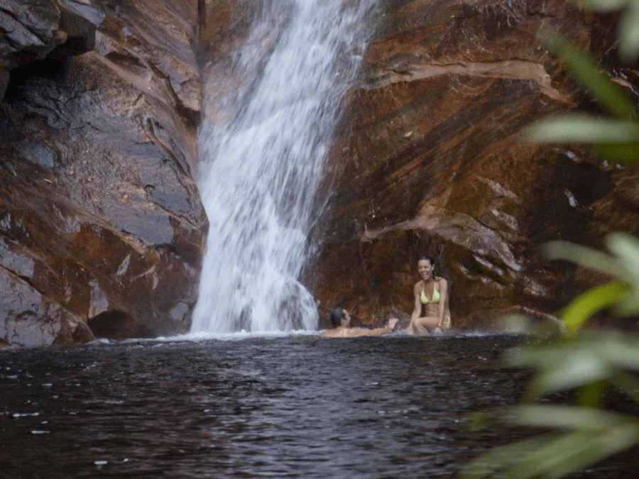 motorcar falls people under waterfall